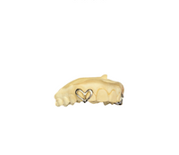 A gold twin cap, with a hallow heart that covers 2 teeth